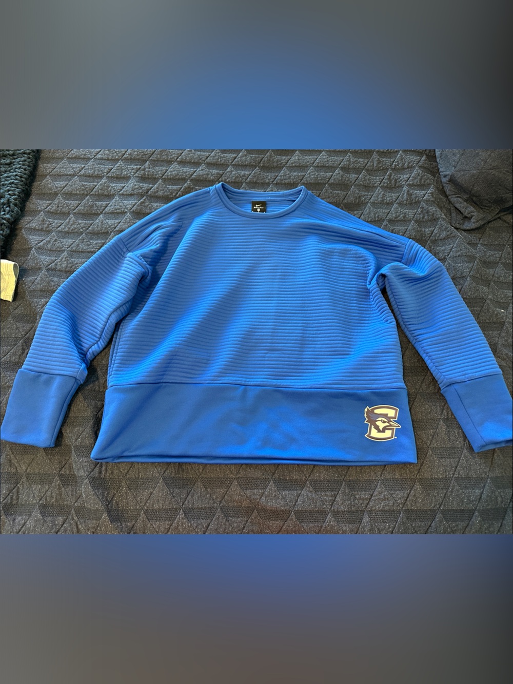 Women’s Nike Blue Ribbed Crewneck Sweatshirt with Creighton Bluejays logo